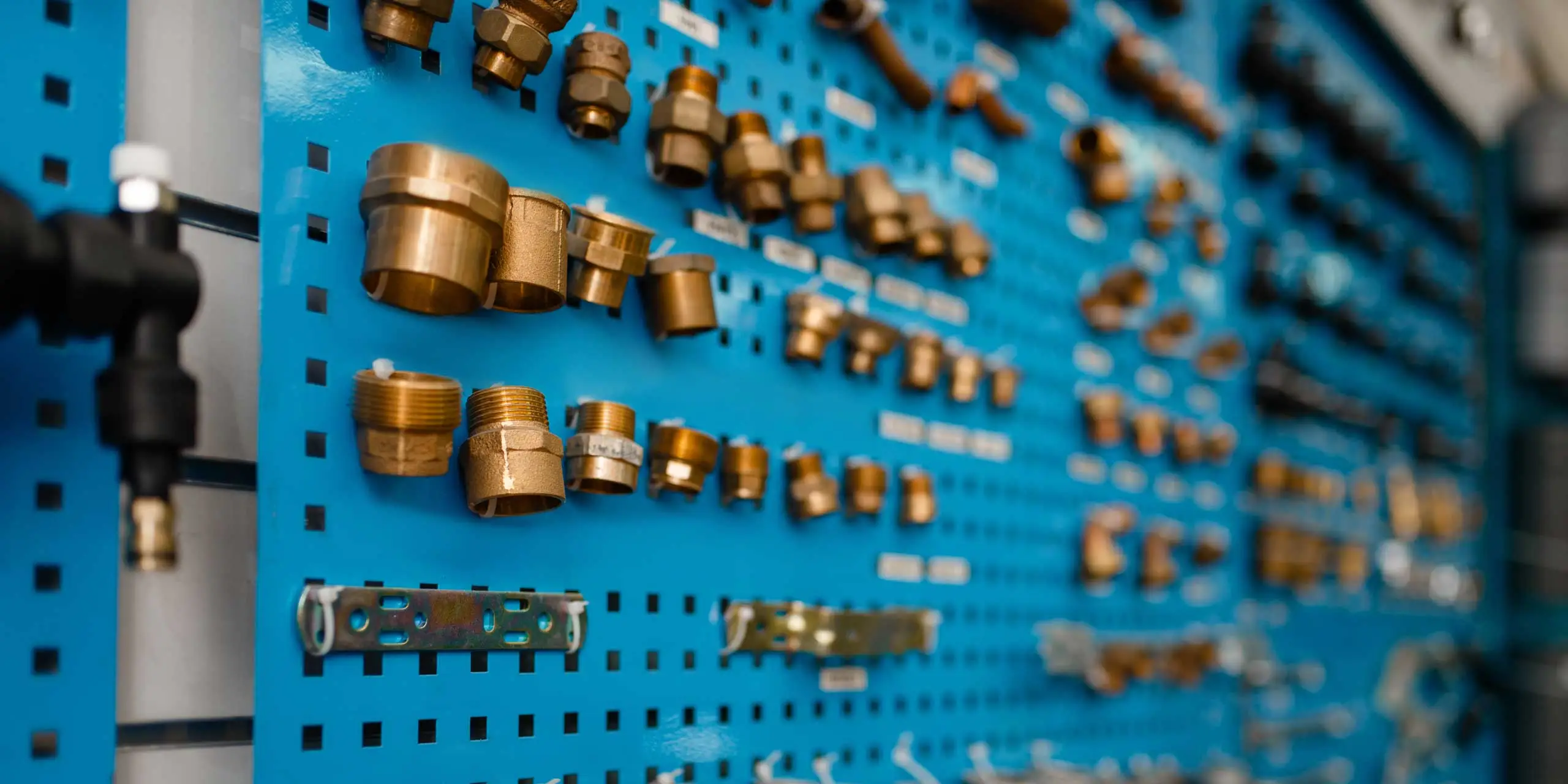 Plumbing tools like piping and fittings on a board